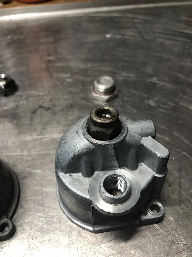 Remove jet holder through drain plug?