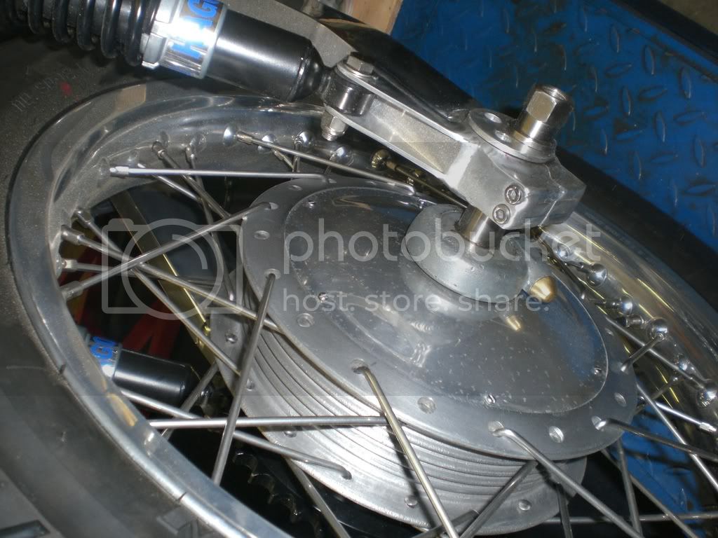 One piece rear wheel spindle