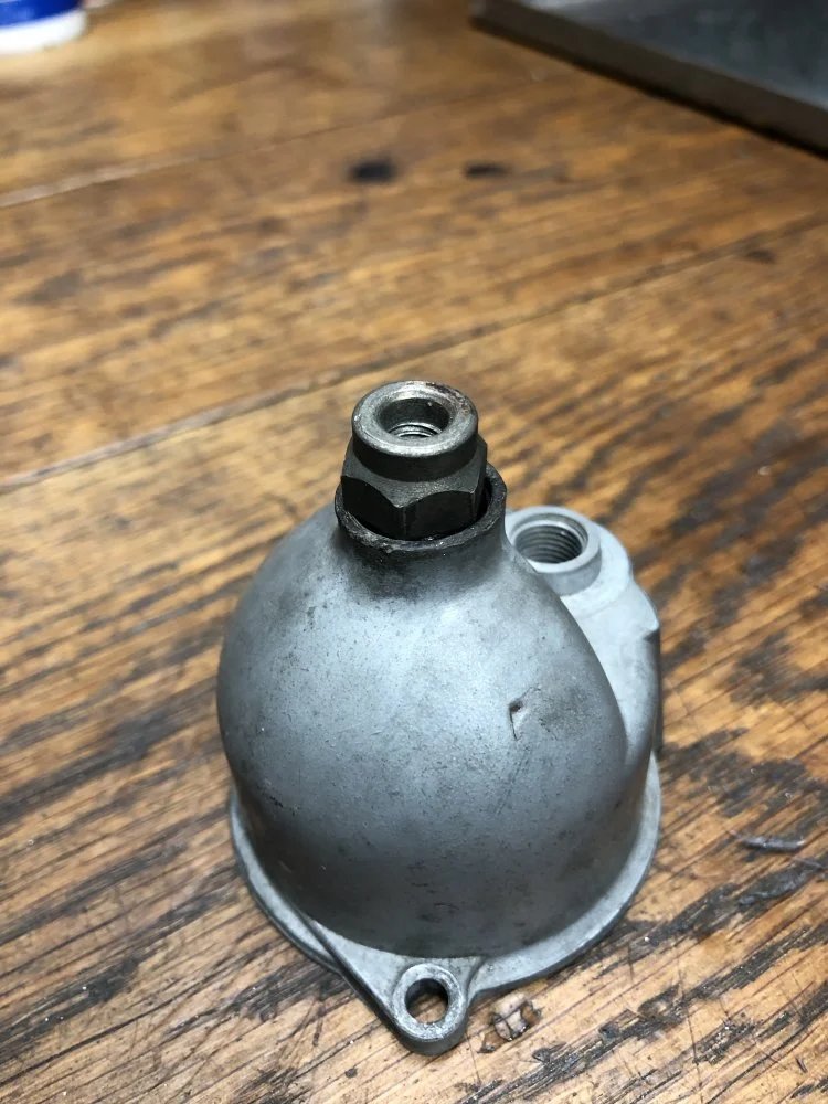 Remove jet holder through drain plug?