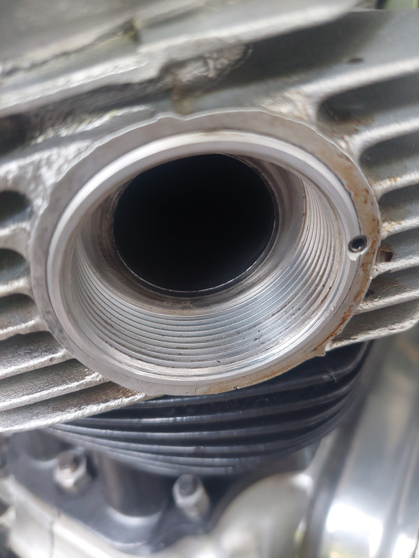 Engineering compromises leading to exhaust threads stripped (2012)