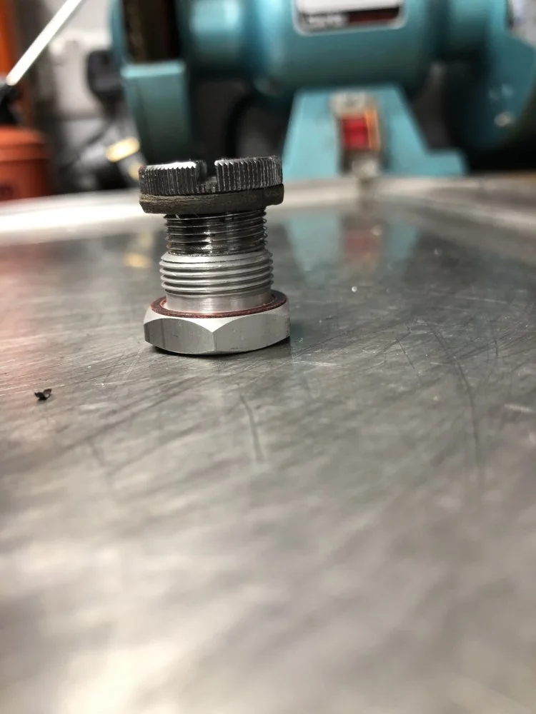 Remove jet holder through drain plug?