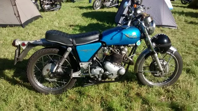 Early oil tank banjo feed and return