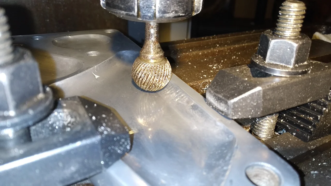 Dressing footrest support plates after welding