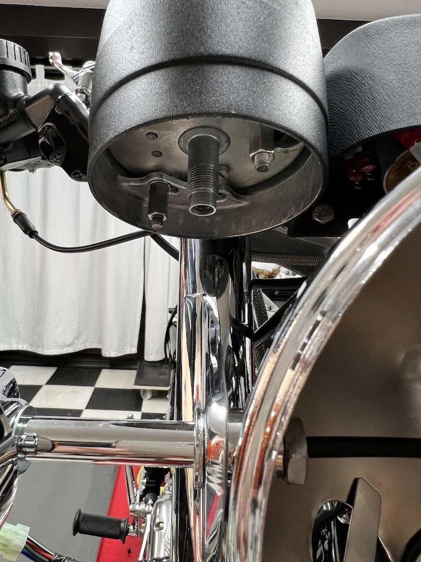 Speedo and Tach cables fouling the headlamp ears? Access Norton