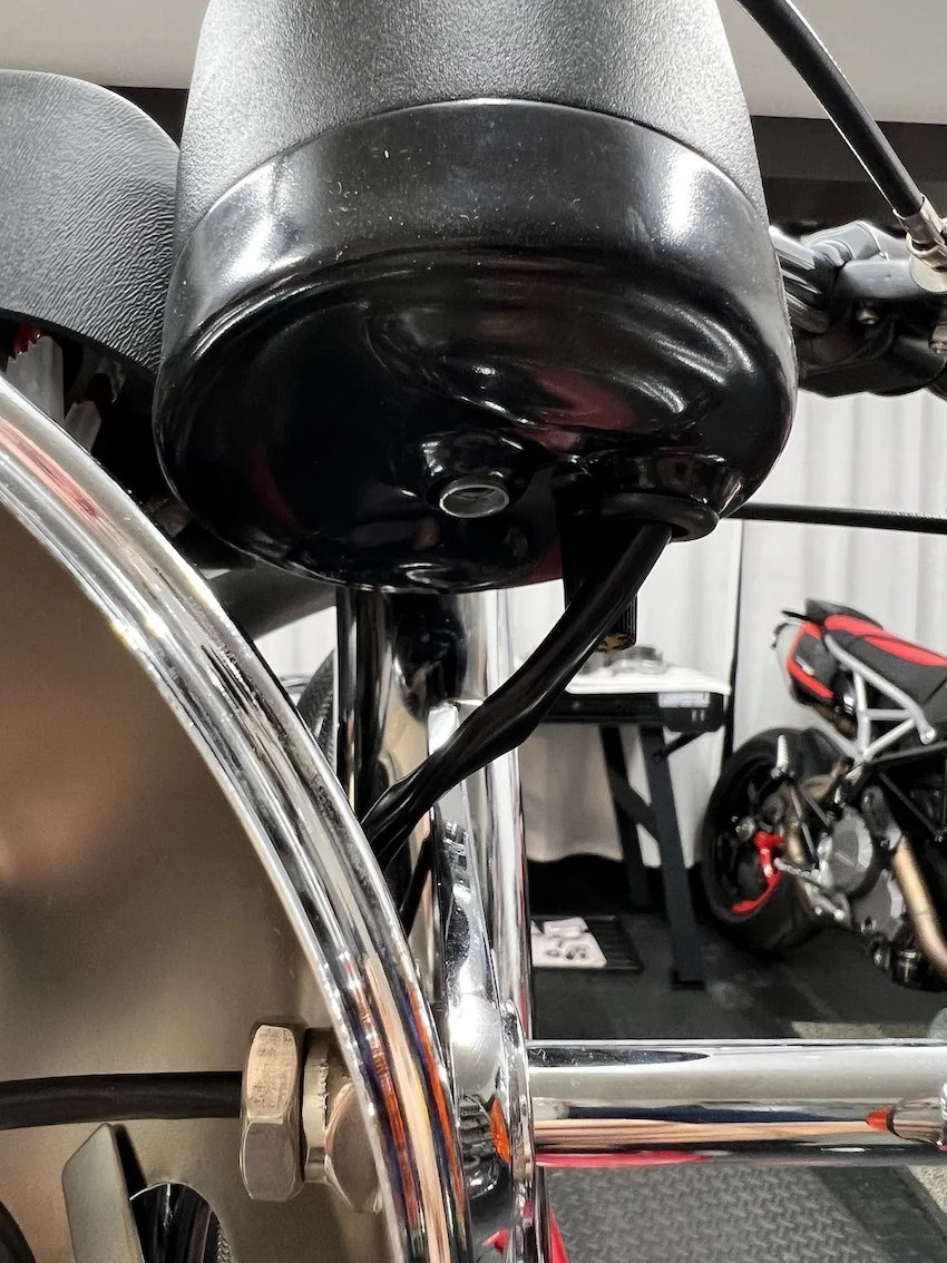 Speedo and Tach cables fouling the headlamp ears? Access Norton