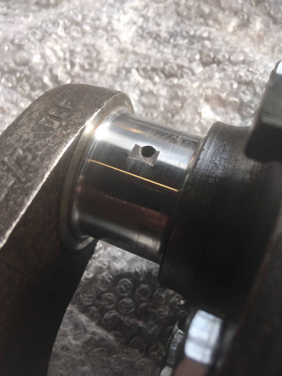 Crank pin oil holes