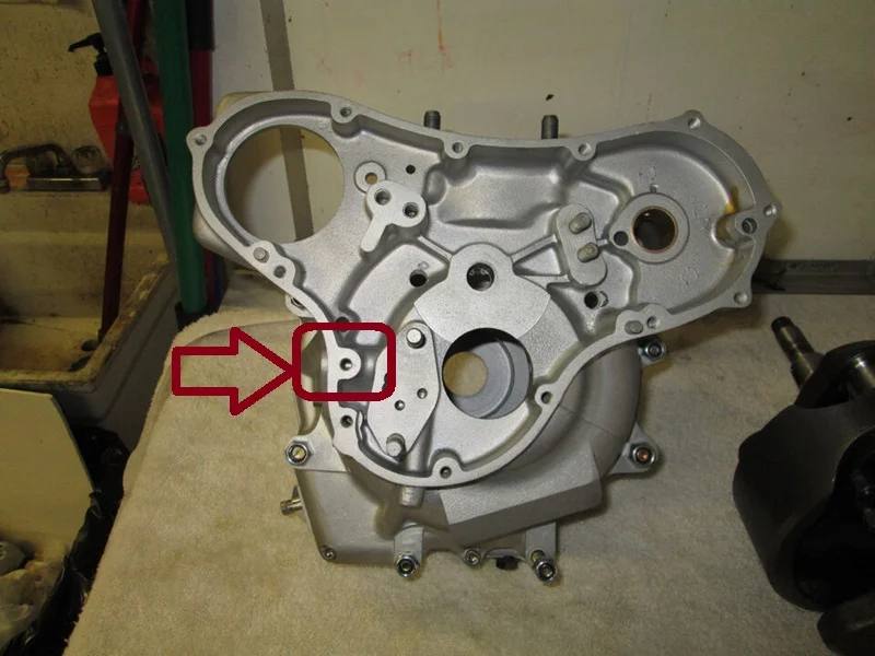 Where does the excess pressure oil from the relief valve flow?