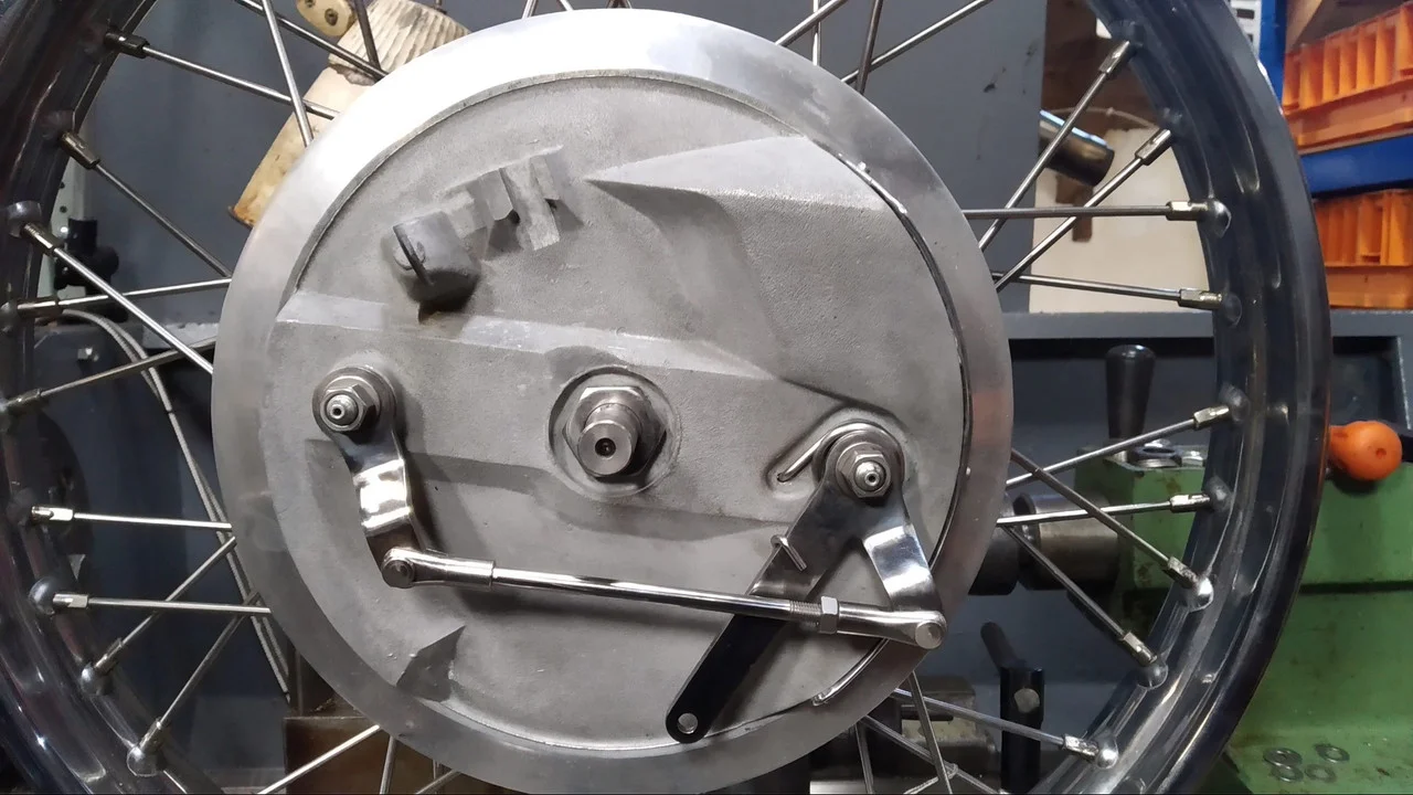 Blasting a cylinder head with fine grit.