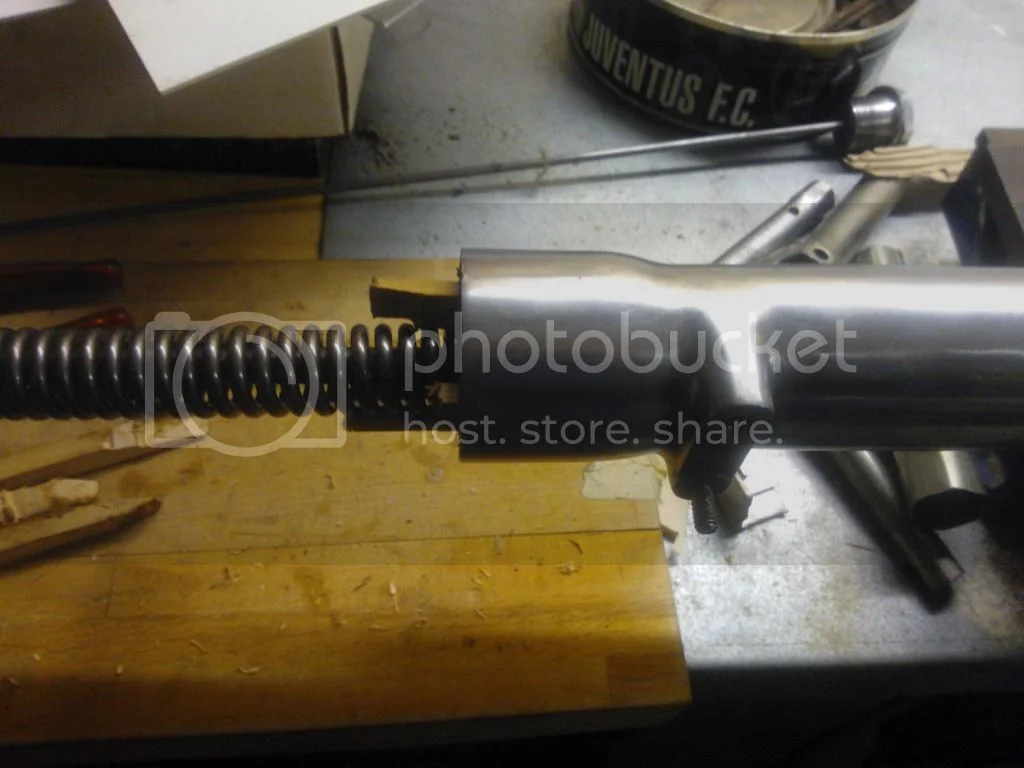 fork slider retaining bolt turning loose, oil spilling